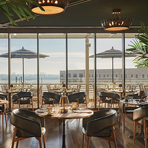 Restaurant interior with windows showing outdoor view 